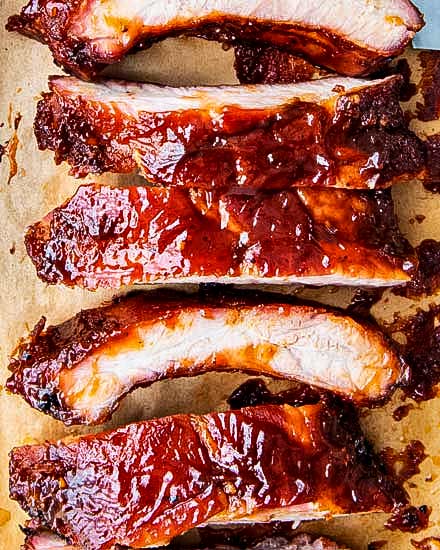 Delicious homemade smoked ribs are easier to make than you think, especially using the popular 3-2-1 method.  Fall of the bone tender, and lip-smackingly good, these ribs are FABULOUS!! #ribs #pork #bbq #smoked #smoking #grilling #easyrecipe