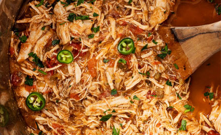 Tender shredded chicken, smothered in the most mouthwatering Mexican sauce made from salsa, green chiles, tomatoes and plenty of bold spices!  Perfect pantry meal, and can be used for so many things (tacos, enchiladas, etc). #chicken #mexican #salsa #shredded #instantpot #pressurecooker #slowcooker #crockpot #cincodemayo #taconight