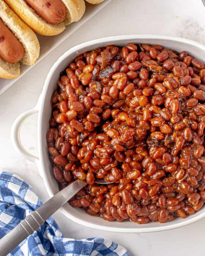 dish with baked beans and spoon 