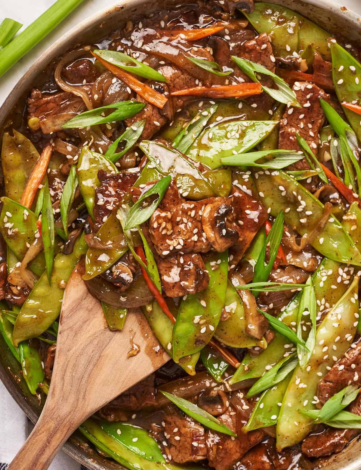 This black pepper beef stir fry is made with tender pieces of steak that are tossed in a deliciously sticky, savory, and slightly sweet sauce that perfectly coats the beef and veggies! Made in one skillet, and ready in about 30-40 minutes, it’s the ultimate weeknight dinner idea. Skip the takeout and make your own!