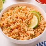 Soft and fluffy rice, loaded with flavor, made with just 5 simple ingredients, and cooked easily on the stovetop. Perfect for your Cinco de Mayo celebration, Taco Tuesday, or any Tex-Mex style recipe!