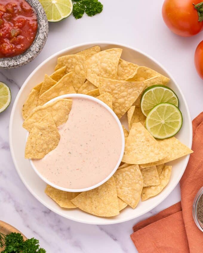 bowl of salsa ranch dip with tortilla chips.