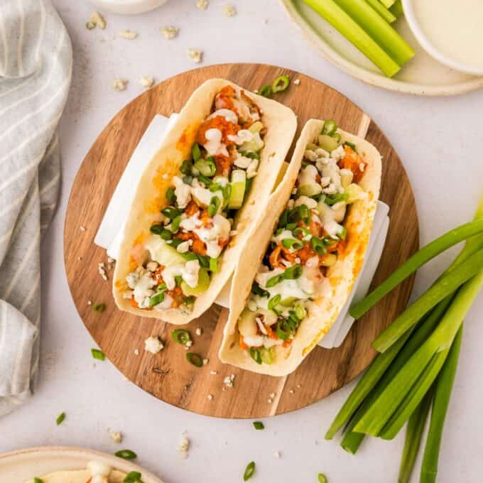 overhead photo of chicken tacos on a cutting board.