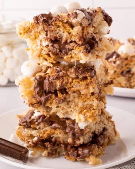 These gooey s'mores rice krispie treats are such an easy and fun to make dessert. This version is actually baked for just a few minutes to get the marshmallows on top nice and toasty, and the chocolate bars melted, just like a campfire s'more!