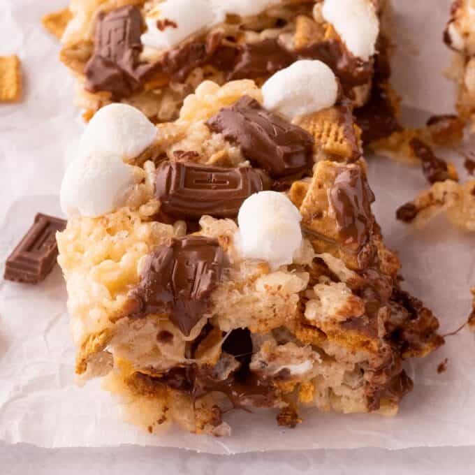 a few s'mores rice krispie treats on a piece of parchment paper.