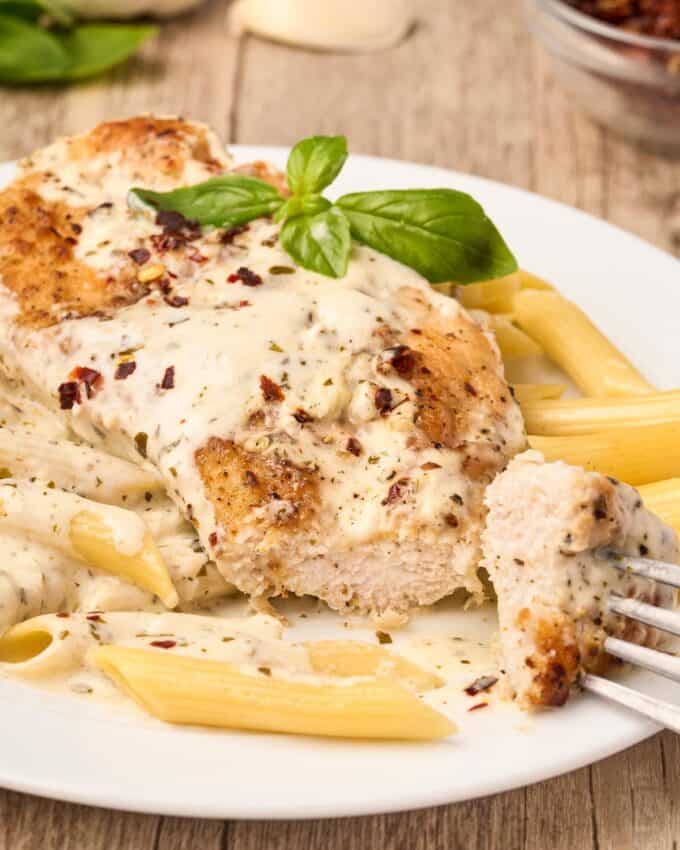 Forkful of a creamy chicken breast