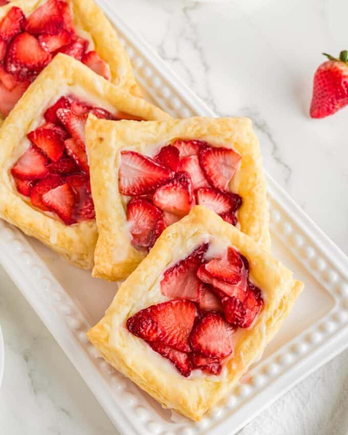 strawberry danish on a white rectangular platter