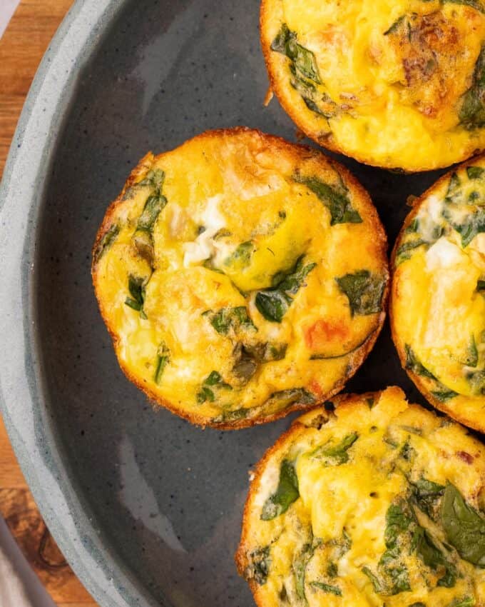 overhead photo of egg bites on grey plate.