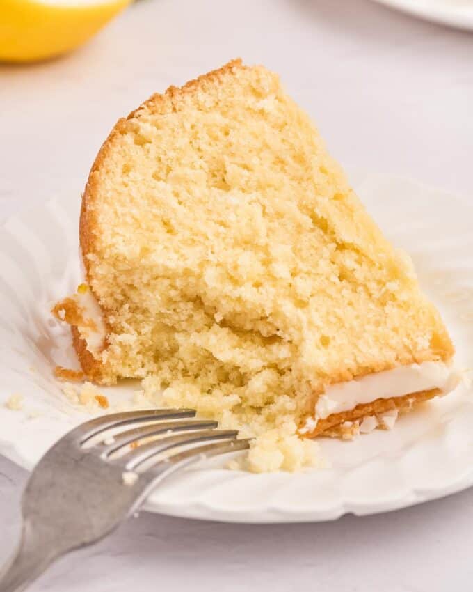 slice of bundt cake with a bite taken out of it.