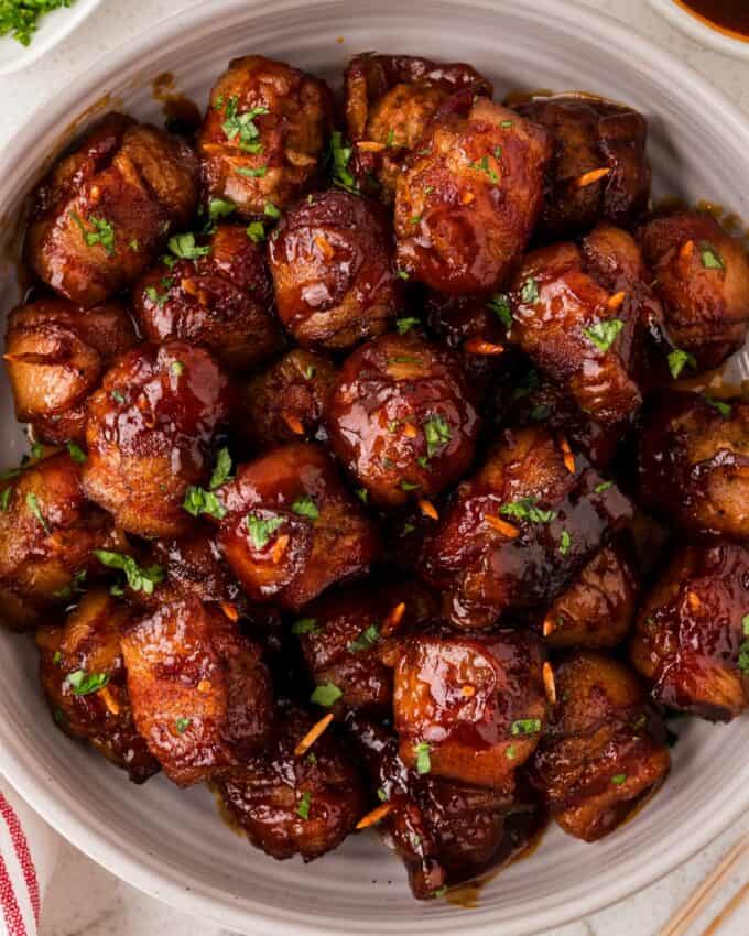 bowl full of bacon wrapped crockpot meatballs