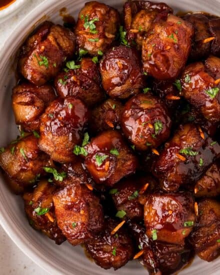 These bacon-wrapped brown sugar bbq meatballs are perfect for any party, and so easy to make! Frozen meatballs are thawed, wrapped in smoky bacon, coated in a spiced brown sugar mixture, tossed with bbq sauce and slow cooked to perfection. Plus, this recipe only has 5 ingredients!