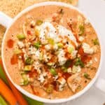 overhead photo of a white soup mug full of buffalo chicken chili