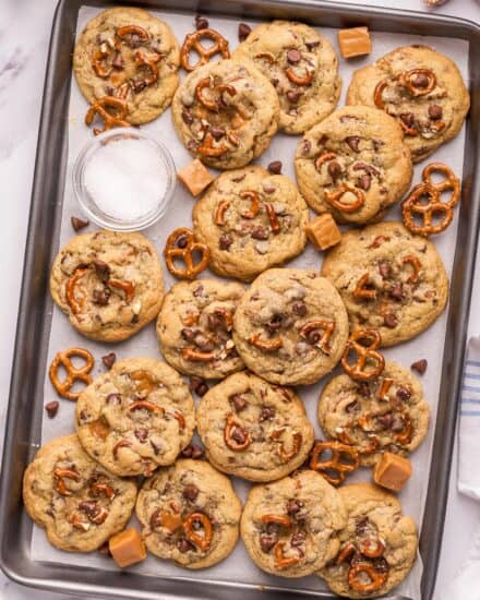 These bakery-style kitchen sink cookies are soft and chewy, and oh so delicious! Made with two types of chocolate, gooey caramel, crunchy pretzels, and flaky sea salt, they're perfect for cookie exchanges, dessert trays, or a fun afternoon treat.