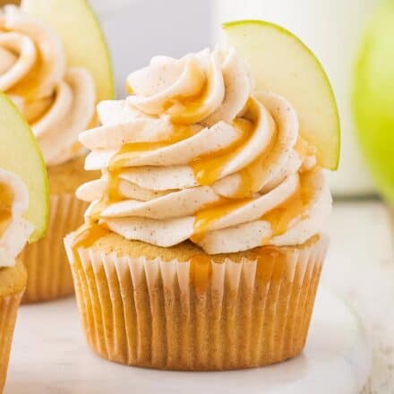 These caramel apple cupcakes are the perfect blend of fluffy, soft, and moist. Studded with diced apples and topped with a generous swirl of caramel cinnamon buttercream frosting, they taste like a sweet caramel apple, and are perfect for the Fall season!