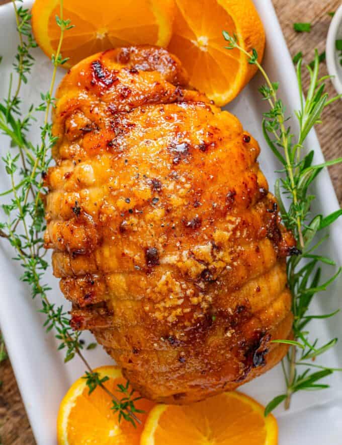 Save yourself some money during the holidays by making a Honey Baked Turkey Breast at home!  Moist turkey is cooked with butter and honey, then slathered with a sticky sweet and smoky glaze that’s broiled until it becomes a glorious sugary crust!