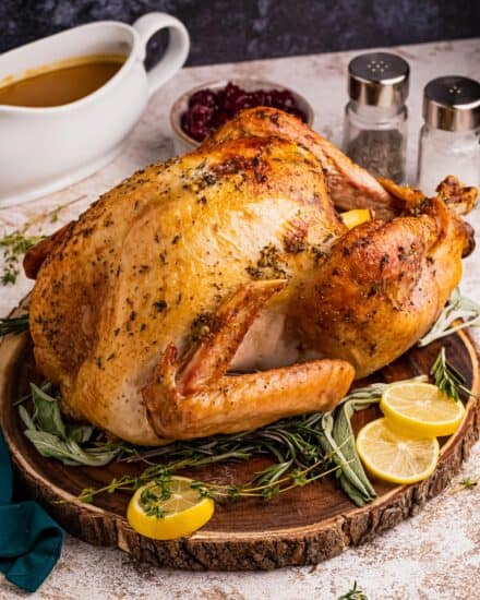 Turkey is slathered in a savory garlic and herb butter, stuffed with aromatics like onion, lemon, and herbs, then roasted until crispy on the outside and moist and tender inside. It’s perfect for your Thanksgiving or other holiday dinners!