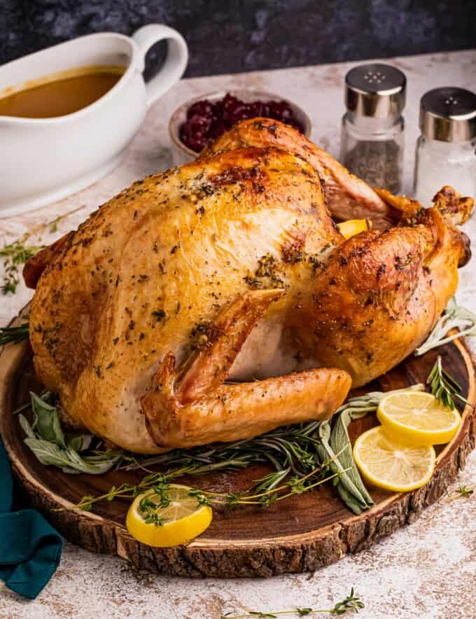 Turkey is slathered in a savory garlic and herb butter, stuffed with aromatics like onion, lemon, and herbs, then roasted until crispy on the outside and moist and tender inside. It’s perfect for your Thanksgiving or other holiday dinners!