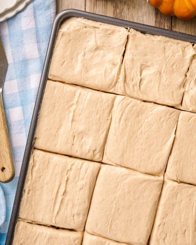 frosted pumpkin bars in baking pan.