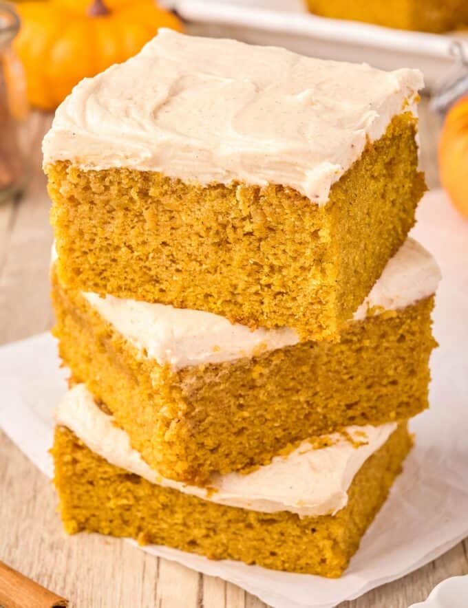 These soft and moist spiced pumpkin bars are smothered with a layer of cinnamon cream cheese frosting that's irresistible! They’re the perfect Fall baking treat!