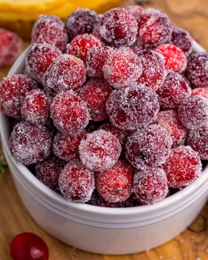 white ramekin of sugared cranberries