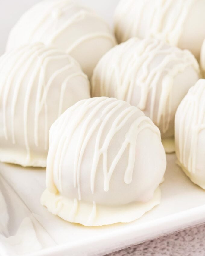 raspberry cake balls on white plate