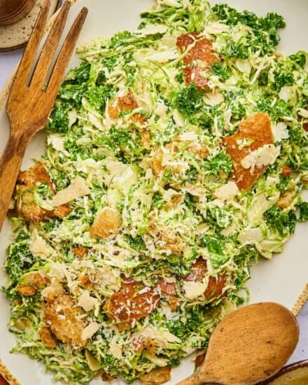 This twist on a classic caesar salad is made with finely chopped kale, shaved brussels sprouts, and easy homemade croutons! You can make this even easier by using store-bought dressing or make your own, and you can add some grilled chicken, salmon, or shrimp for a complete meal!