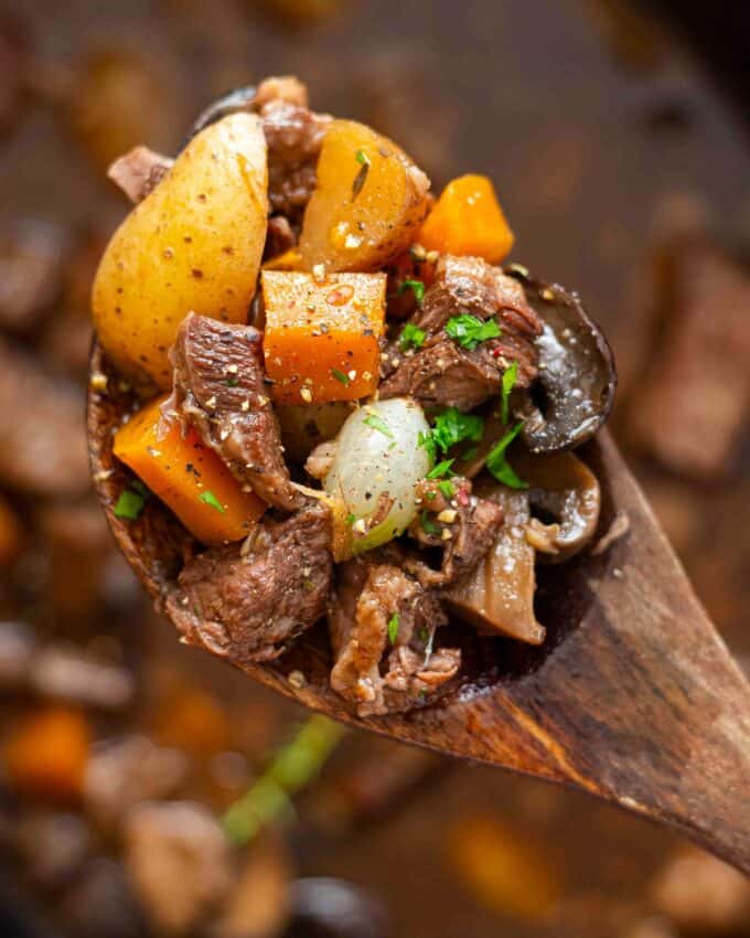 wooden spoon of beef stew