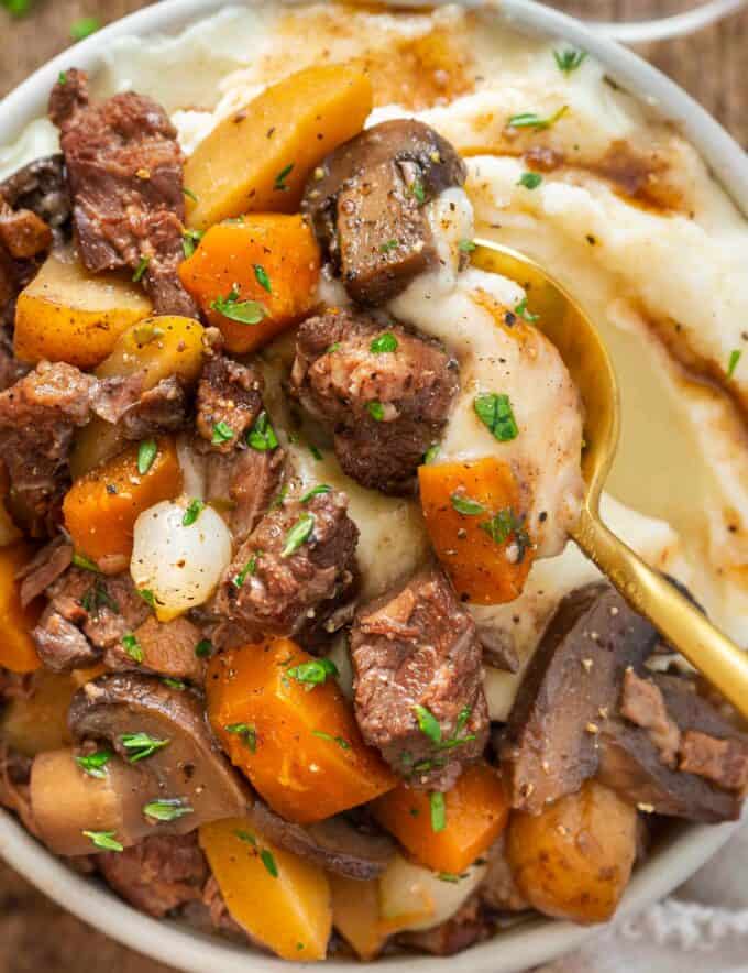 This rich and hearty beef bourguignon is made easily in the slow cooker. Come home after a long day of work to a deliciously savory dinner that's already done! Oven, stovetop, and Instant Pot directions are included as well.