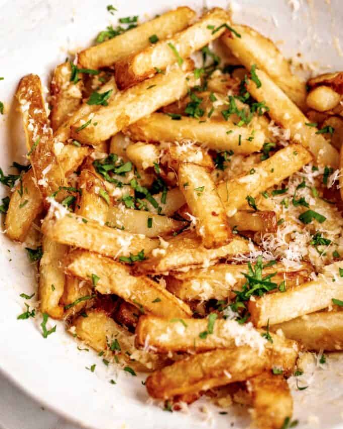 serving bowl of garlic parmesan french fries made in the air fryer.