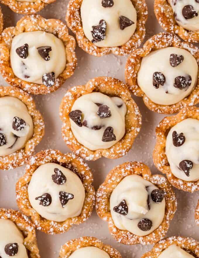 Everything you love about silky and sweet cannoli, but in a fun, easy to make bite-sized form! Made simply with pie crust (store-bought to be even easier), these cannoli bites are easy to customize to your tastes, and always a crowd-pleaser!